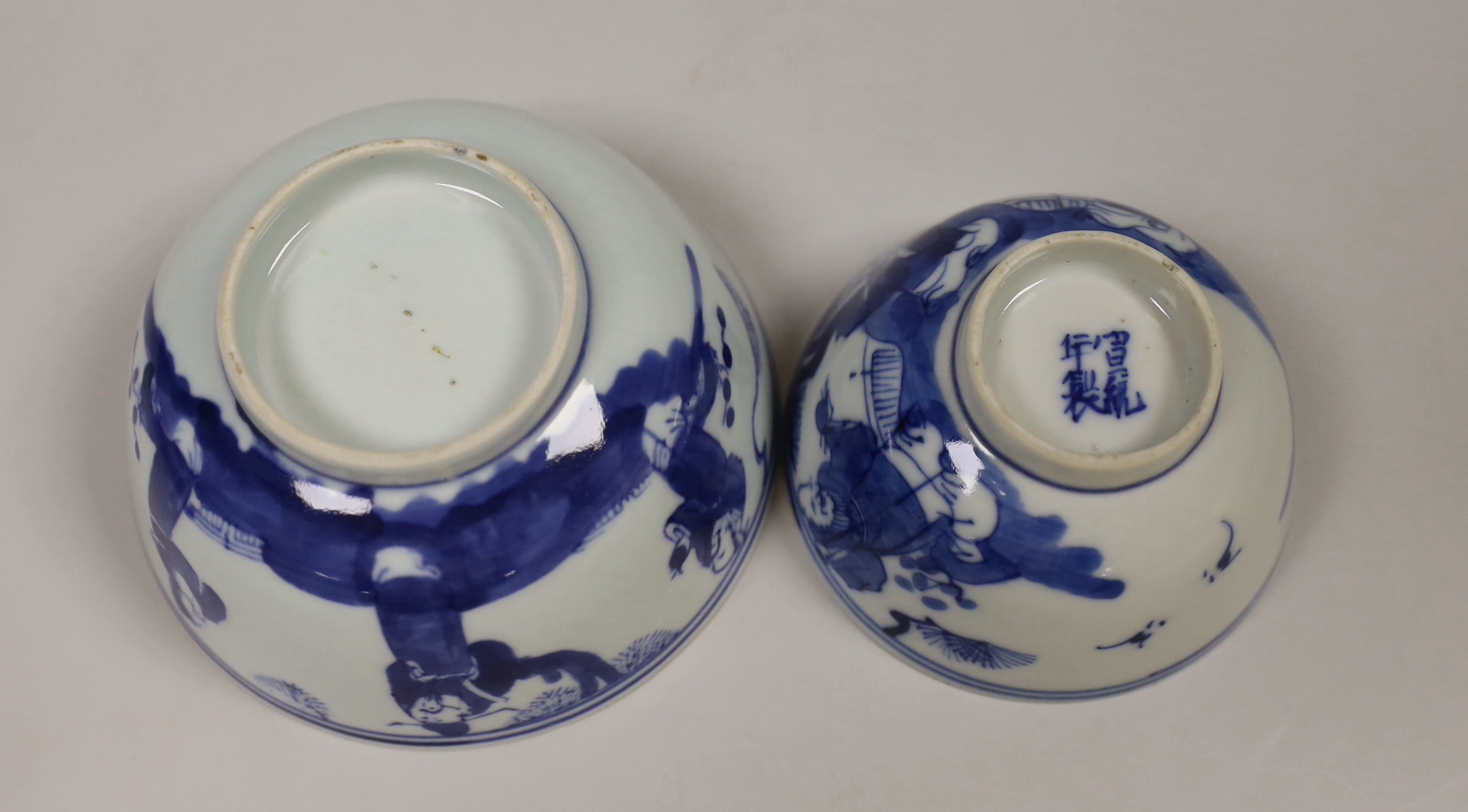 Chinese terracotta horse head, possibly Tang dynasty and two Chinese blue and white bowls decorated with elders, the largest 12cm high